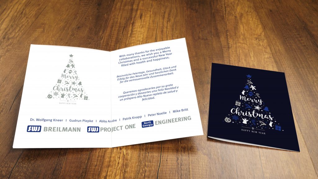 Mehrsprachige Weihnachtskarte im CI mit dunkelblauer Titelseite, Icon-Tannenbaum und Grußtexten EN/DE/ES